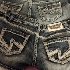Shorts Rock& Roll cowgirl sizes 27& 26 they are all dark blue light and medium b